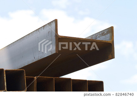 Metal profile beam in packs at the warehouse of metal products Metal profile beam in packs at the warehouse of metal products 82846740