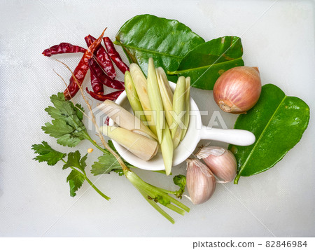 Tom Yum Herbs Thai food, chili, garlic, shallots, coriander, kaffir lime leaves, and lemongrass. on a white background Tom Yum Herbs Thai food, chili, garlic, shallots, coriander, kaffir lime leaves, and lemongrass. on a white background 82846984