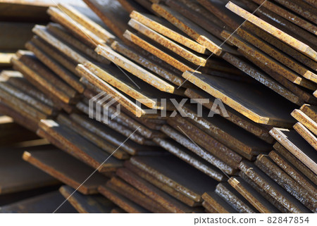 Metal profile strip in packs at the warehouse of metal products 82847854