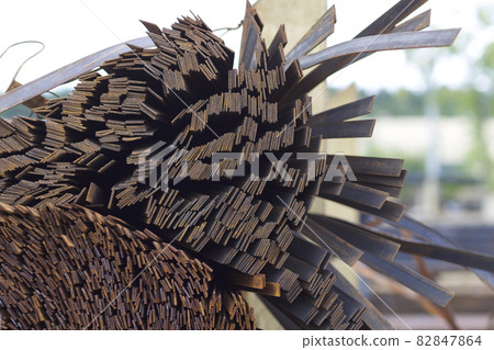 Metal profile strip in packs at the warehouse of metal products 82847864