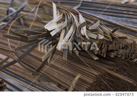 Metal profile strip in packs at the warehouse of metal products 82847873