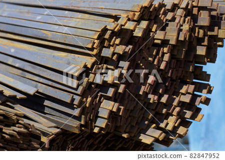 Metal profile strip in packs at the warehouse of metal products 82847952