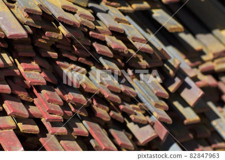 Metal profile strip in packs at the warehouse of metal products 82847963