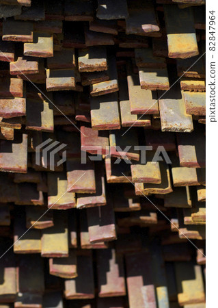 Metal profile strip in packs at the warehouse of metal products Metal profile strip in packs at the warehouse of metal products 82847964