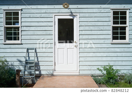 White door of light blue house 2 White door of light blue house 2 82848212