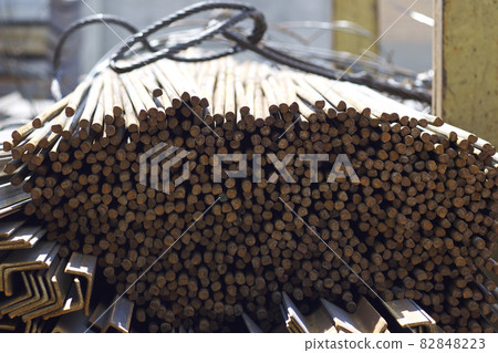 Metal profile of round section in packs at the warehouse of metal products Metal profile of round section in packs at the warehouse of metal products 82848223