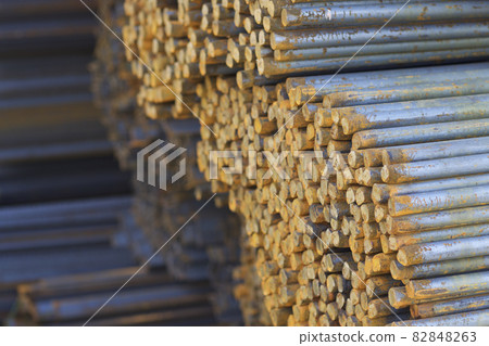 Metal profile of round section in packs at the warehouse of metal products 82848263