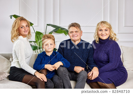 Family evening by smiling european family in living room. 82848710