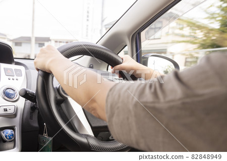 Young woman driving Young woman driving 82848949