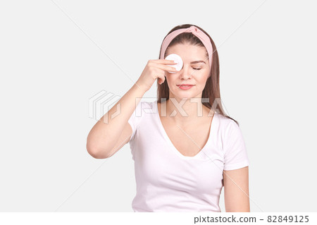 Pretty young woman gesture. Studio portrait. Female person. 82849125