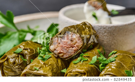 Piece of dolma, on the cut minced meat and rice Piece of dolma, on the cut minced meat and rice 82849435