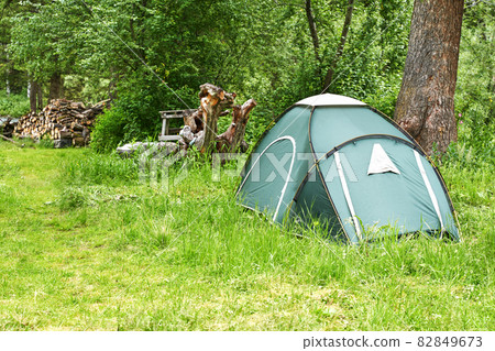 Tent camp in forest. Local travel concept. Sustainable lifestyle. Summer Tent camp in forest. Local travel concept. Sustainable lifestyle. Summer 82849673
