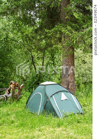 Tent camp in forest. Local travel concept. Sustainable lifestyle. Summer Tent camp in forest. Local travel concept. Sustainable lifestyle. Summer 82849674