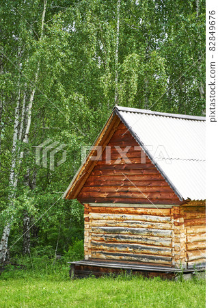Wood house in forest. Local travel concept. Sustainable lifestyle. Summer Wood house in forest. Local travel concept. Sustainable lifestyle. Summer 82849676