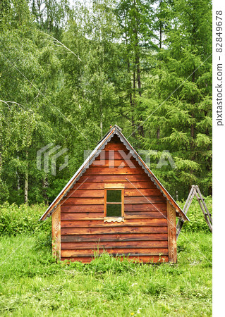 Wood house in forest. Local travel concept. Sustainable lifestyle. Summer  82849678