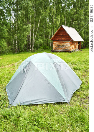 Tent camp in forest. Local travel concept. Sustainable lifestyle. Summer Tent camp in forest. Local travel concept. Sustainable lifestyle. Summer 82849683