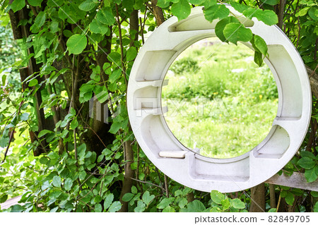 Round mirror in forest. Local travel concept. Sustainable lifestyle. Summer Round mirror in forest. Local travel concept. Sustainable lifestyle. Summer 82849705