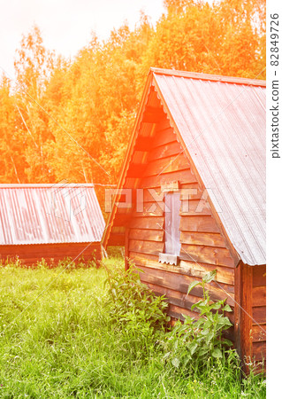 Wood house in forest. Local travel concept. Sustainable lifestyle. Summer Wood house in forest. Local travel concept. Sustainable lifestyle. Summer 82849726