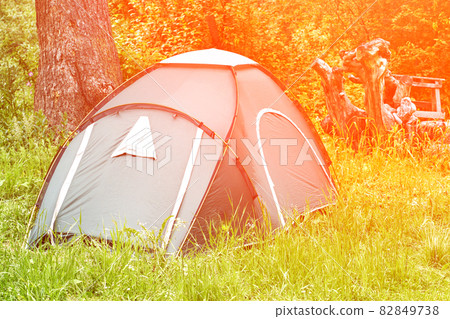 Tent camp in forest. Local travel concept. Sustainable lifestyle. Summer Tent camp in forest. Local travel concept. Sustainable lifestyle. Summer 82849738