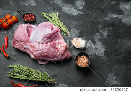 Pork meat ingredients, on black dark stone table background, with copy space for text Pork meat ingredients, on black dark stone table background, with copy space for text 82850397