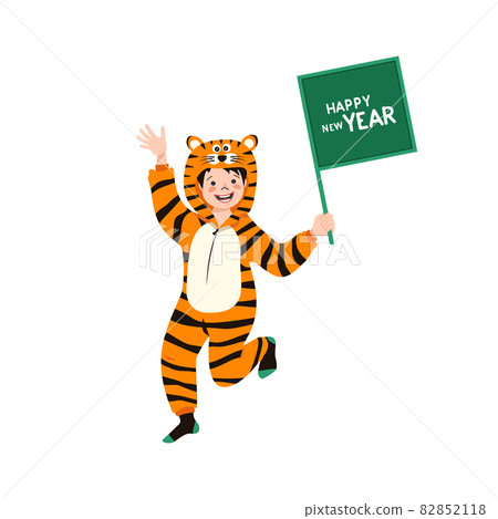 Boy in carnival costume of Chinese tiger with sign for text in hand. Child in party pyjamas. Kid in jumpsuit or kigurumi, festive clothes for New Year, Christmas or holiday Boy in carnival costume of Chinese tiger with sign for text in hand. Child in party pyjamas. Kid in jumpsuit or kigurumi, festive clothes for New Year, Christmas or holiday 82852118