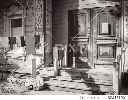 An old backyard with bench and laundry is drying An old backyard with bench and laundry is drying 82858160