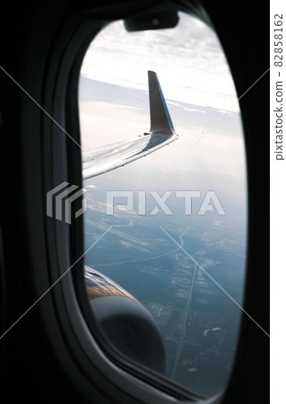 View from an airplane window outside at the wing 82858162