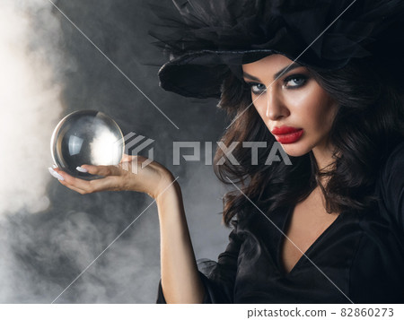 Halloween witch with crystal ball Halloween witch with crystal ball 82860273