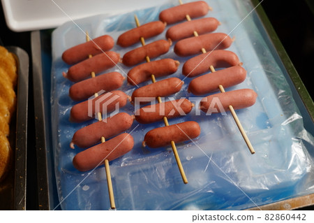 Small hot dogs on skewers Small hot dogs on skewers 82860442