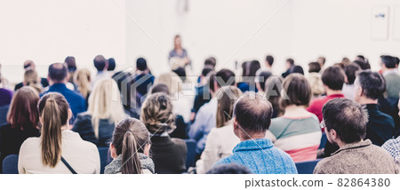 Woman giving presentation on business conference. 82864380