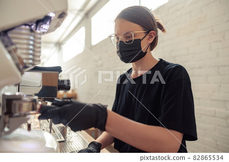 Professional barista is making fresh takeaway latte 82865534