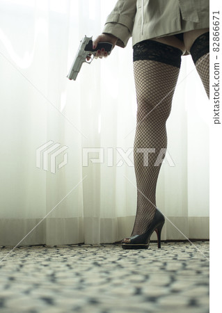 Pistol gun on table in room Pistol gun on table in room 82866671