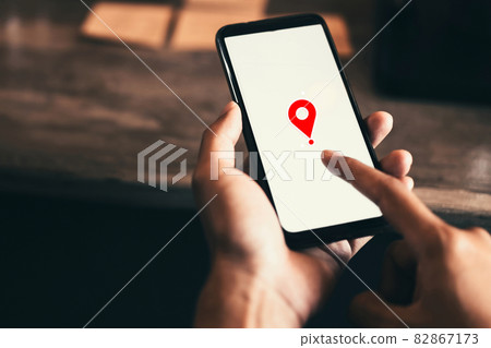 Woman hand using smart phone with navigator location point at coffee shop background. Technology interenet and business travel concept. 82867173