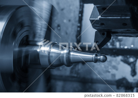 The CNC lathe machine forming cutting the metal shaft parts. The CNC lathe machine forming cutting the metal shaft parts. 82868315