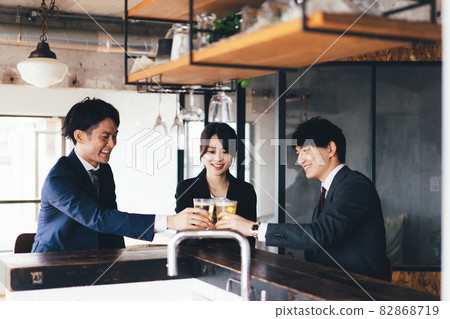 Business person toasting with beer 82868719