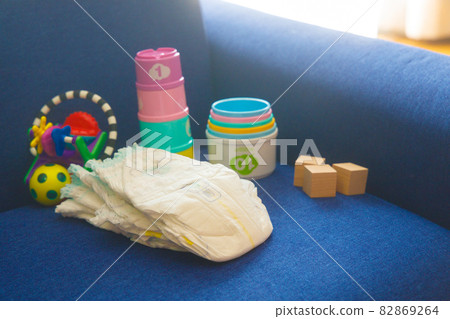 Baby diapers and toys on the sofa Baby diapers and toys on the sofa 82869264