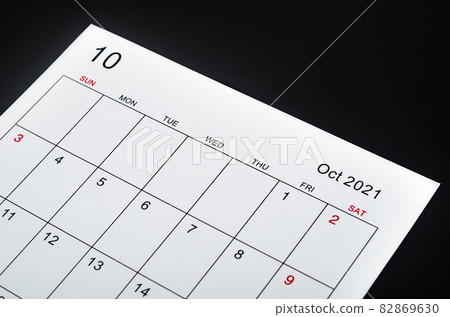 The October 2021 calendar sheet on black background. The October 2021 calendar sheet on black background. 82869630