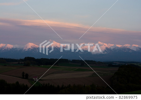 Sunset snow covered mountains 82869975