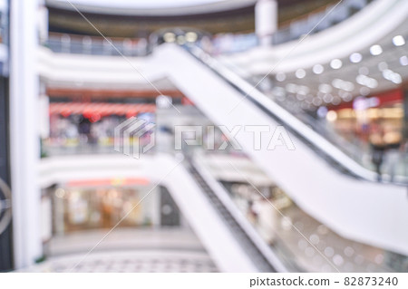 Empty blurry mall background. Defocused wallpaper. Business office interior Empty blurry mall background. Defocused wallpaper. Business office interior 82873240