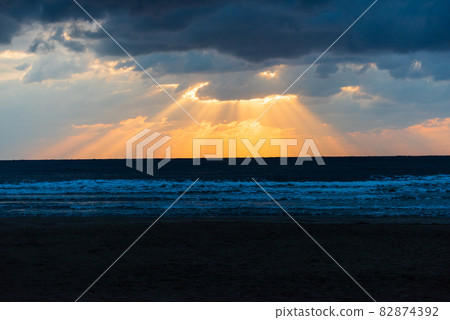 Light beam seen at Inasa beach in the evening 82874392