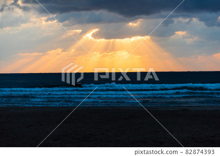 Light beam seen at Inasa beach in the evening Light beam seen at Inasa beach in the evening 82874393