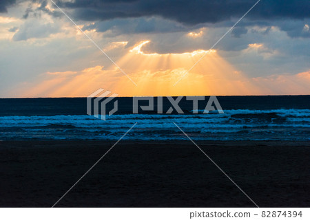 Light beam seen at Inasa beach in the evening Light beam seen at Inasa beach in the evening 82874394