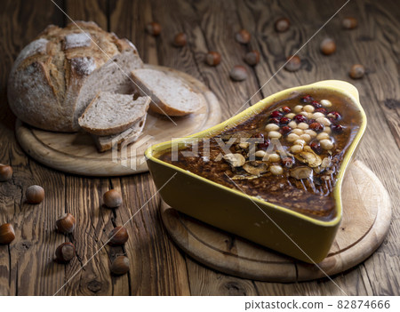 Rough pate with hazelnuts and mushrooms Rough pate with hazelnuts and mushrooms 82874666