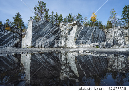 Ruskeala marble quarry. Karelia. Marble quarried in the north of Russia. Natural gray stone background Ruskeala marble quarry. Karelia. Marble quarried in the north of Russia. Natural gray stone background 82877836