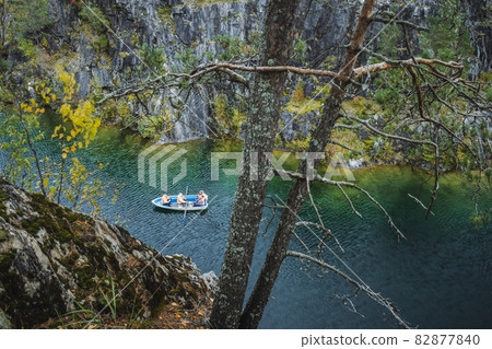 Pleasure boat in Marble canyon in the mountain park of Ruskeala, Karelia, Russia Pleasure boat in Marble canyon in the mountain park of Ruskeala, Karelia, Russia 82877840