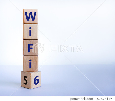 WiFi 5 or 6 symbol. Turned a wooden cube and changed the words WiFi 5 to WiFi 6. Beautiful white background, copy space. Business, technology and WiFi 5 to WiFi 6 concept. WiFi 5 or 6 symbol. Turned a wooden cube and changed the words WiFi 5 to WiFi 6. Beautiful white background, copy space. Business, technology and WiFi 5 to WiFi 6 concept. 82878146