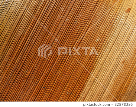Dry palm leaf macro. Background of brown yellow palm leaf with ribbed texture. Dry palm leaf macro. Background of brown yellow palm leaf with ribbed texture. 82878386
