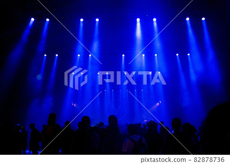 Crowd of people, blue stage lights Crowd of people, blue stage lights 82878736