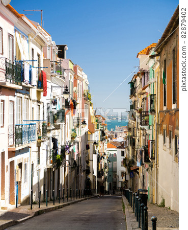 Portugal, Lisbon in summer, local color of narrow old street in Lisbon Portugal, Lisbon in summer, local color of narrow old street in Lisbon 82879402