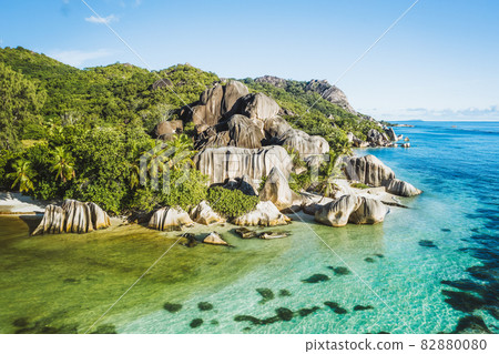 Aerial photo of Seychelles tropical beach Anse Source d'Argent in evening light at La Digue island, highlights Seychelles Aerial photo of Seychelles tropical beach Anse Source d'Argent in evening light at La Digue island, highlights Seychelles 82880080